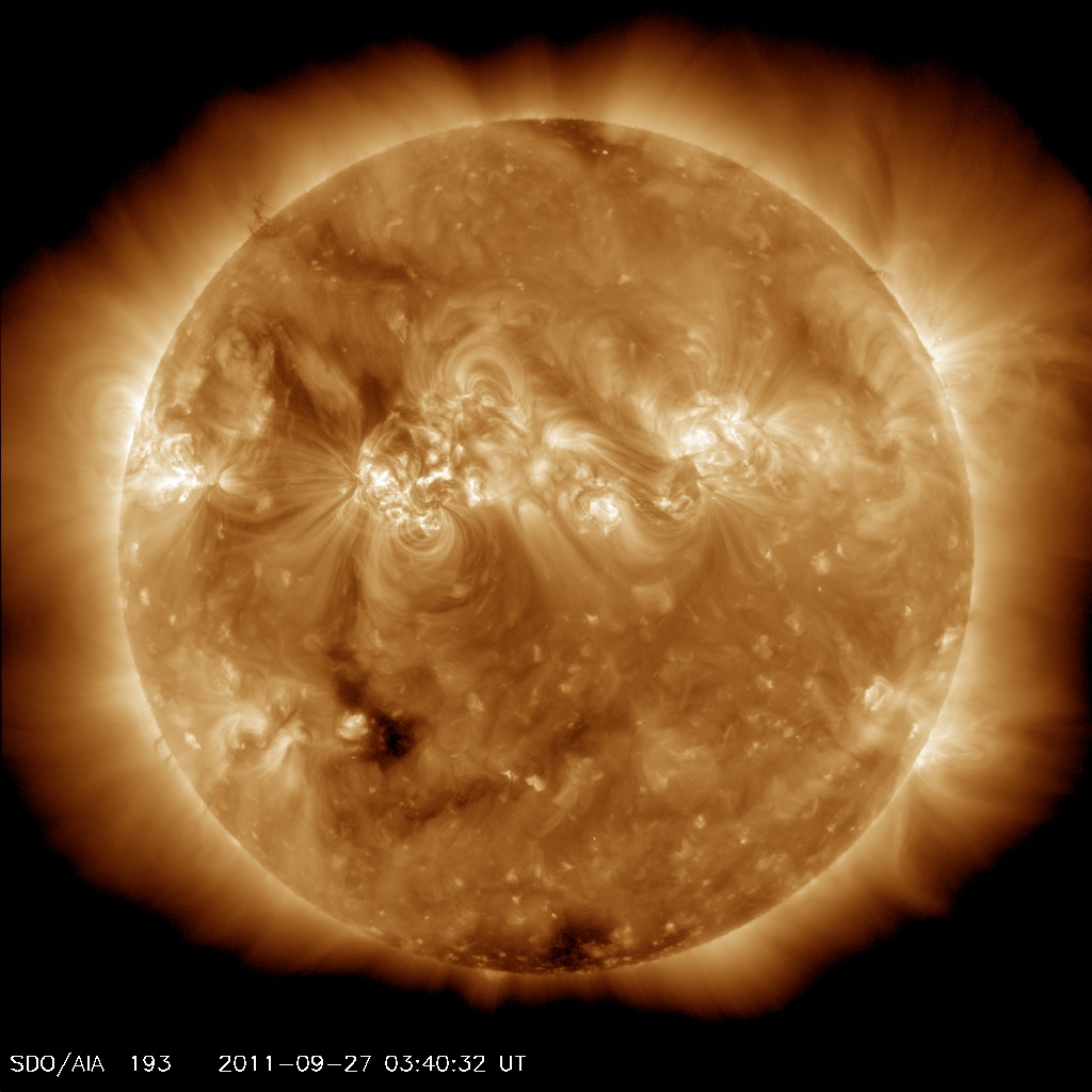 Coronal Holes- 27 Sep 11- A solar wind stream flowing from the indicated coronal hole could reach Earth on Sept. 30th-Oct. 1st, 2011. Credit: SDO/AIA.