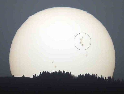 http://spaceweather.com/images2012/08mar12/sunspotsunset_strip.jpg
